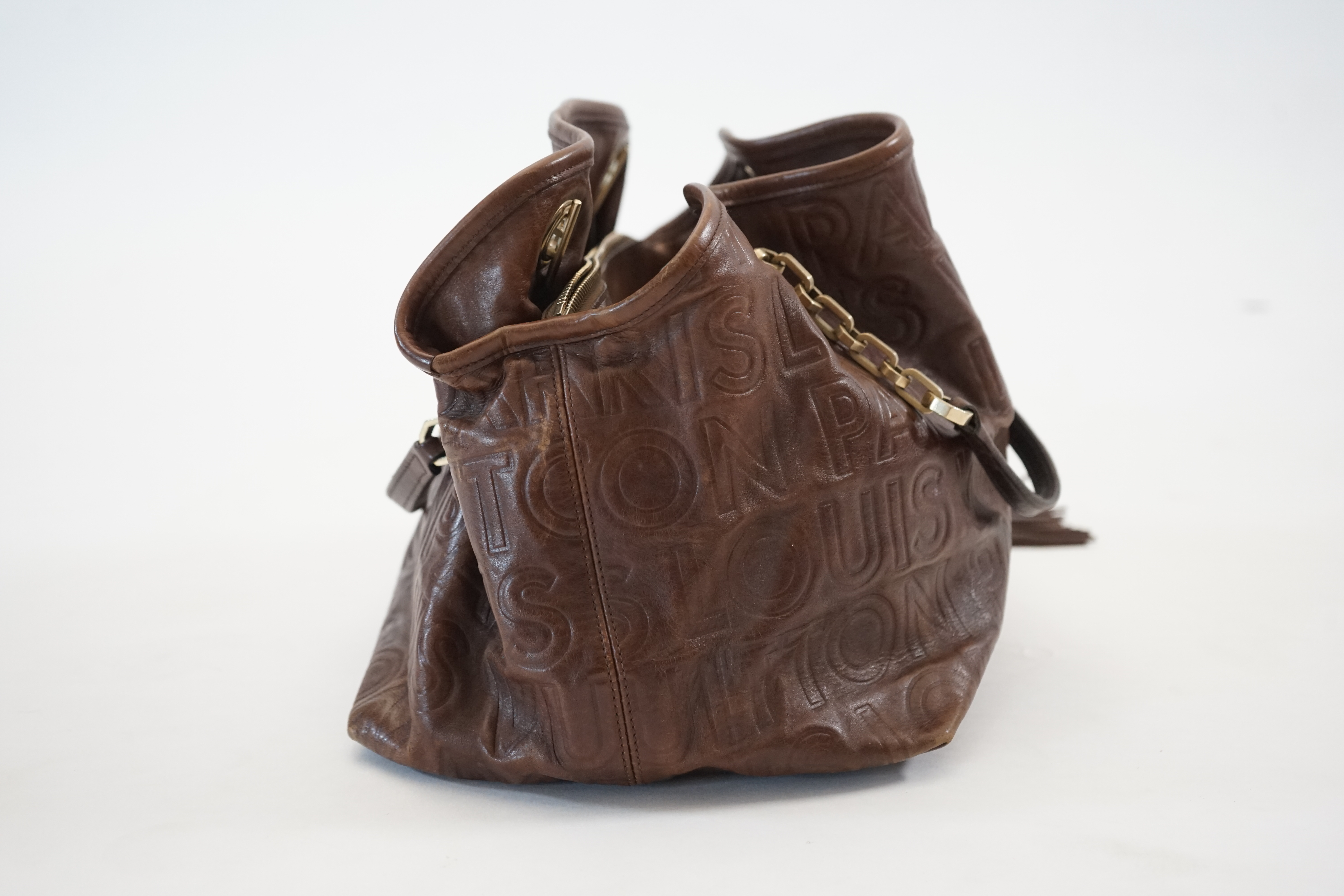 A Louis Vuitton Whisper brown leather handbag, width 31cm, depth 22cm, approx height 26cm